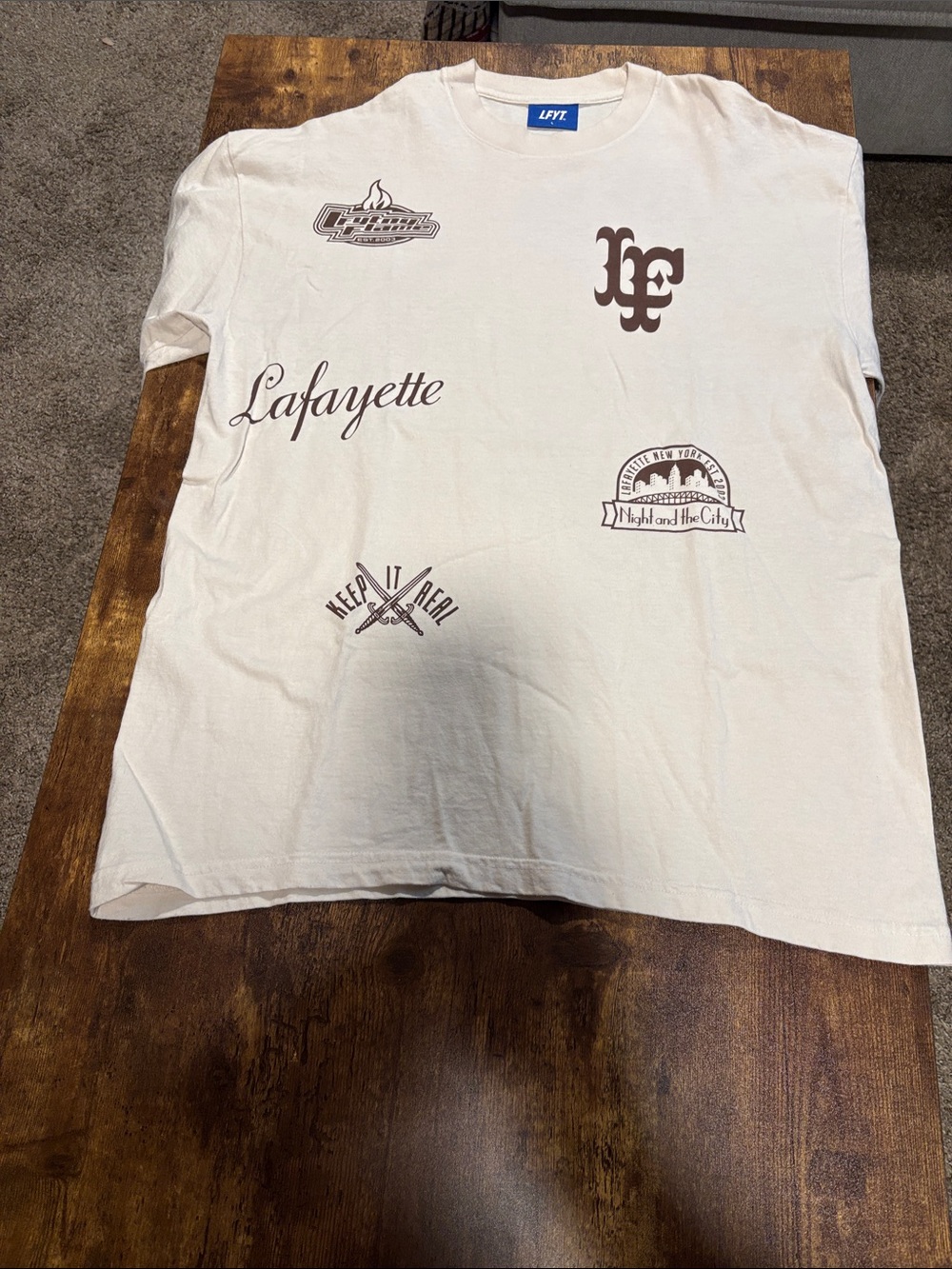 100% cotton Short Sleeve Graphic Tee in Cream and brown size L
